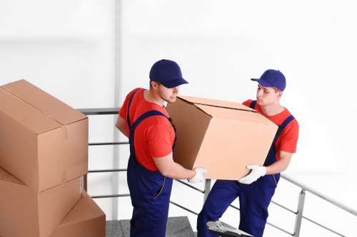 Office removals planning in Southfields with moving boxes and business furniture