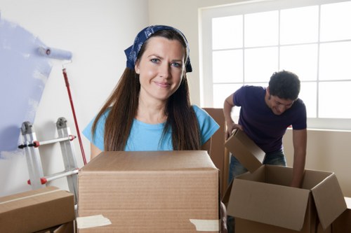 Packed boxes and dismantled furniture prepared for a student move in Southfields