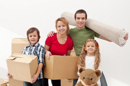 Loading boxes and household items into a van for a Southfields move